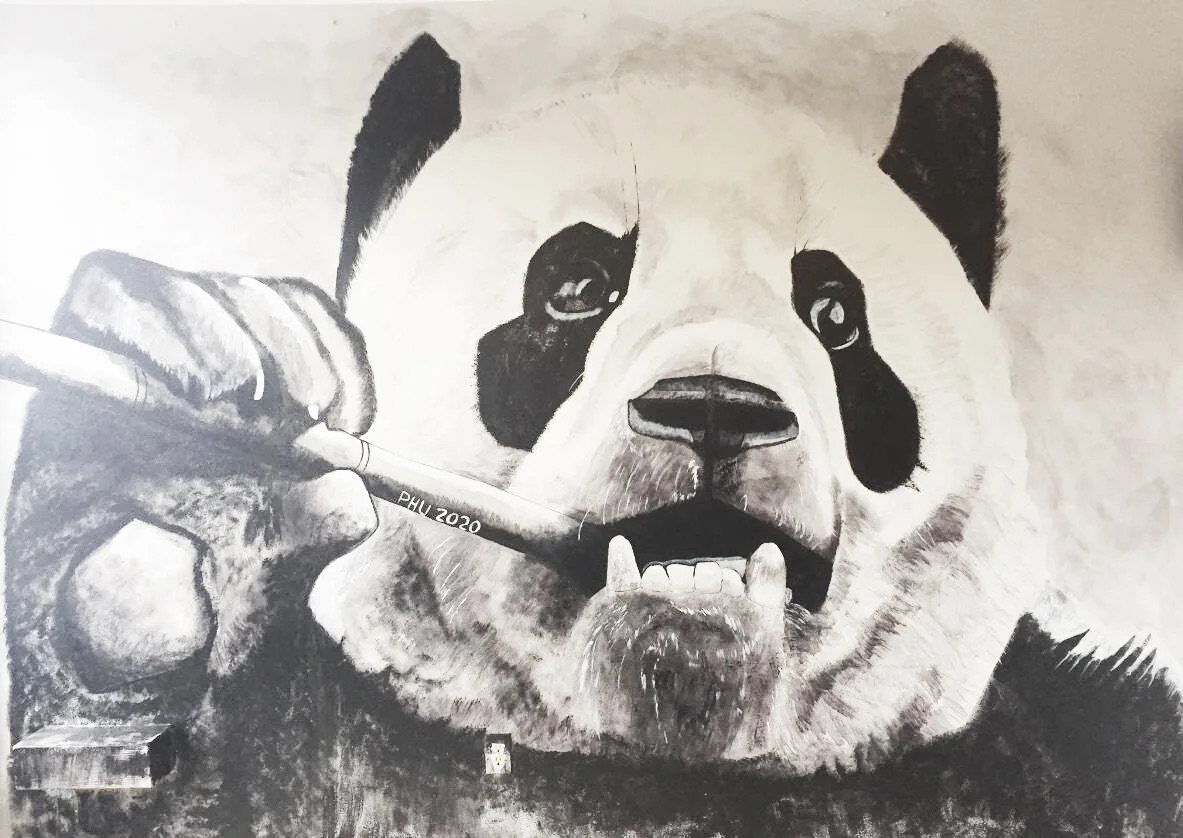 Hand-painted panda mural inside Jade Cafe's dining room in Denver